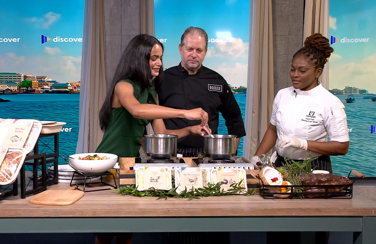 Jada and guests preparing food in the Discover studio.